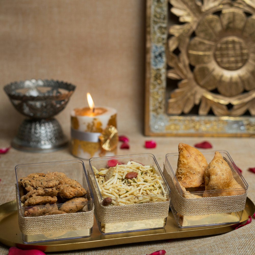 Diwali gift hamper with sweets and a diya